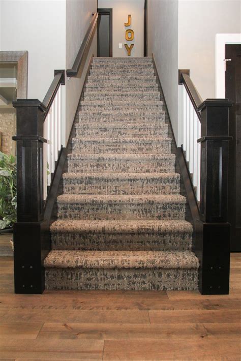 Maple Hardwood Flooring And Brown Patterned Staircase Carpet Stairway
