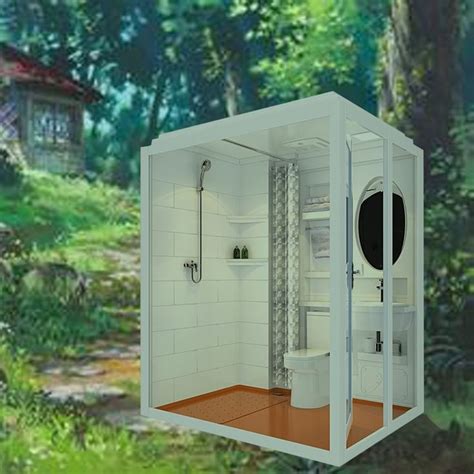 An Open White Box With A Toilet And Shower In The Middle Of A Wooded Area
