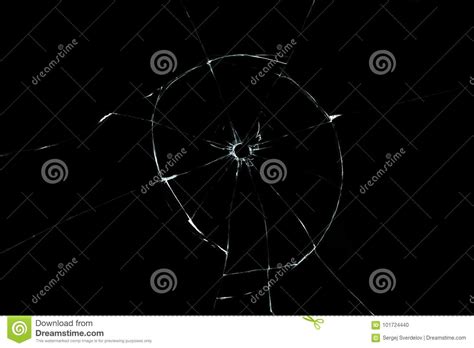 Bullet Hole In Glass Close Up On Black Background Stock Photo Image