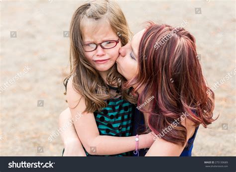 Not mother and daughter… now only foes. Mother Comforting Her Daughter After Getting Hurt At A Park In Reno, Nevada, Usa. Stock Photo ...