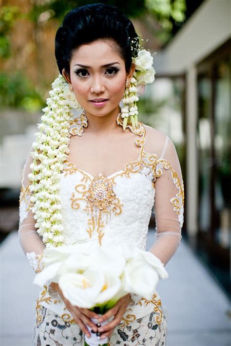 Bride In Indonesian Wedding Garb With Lily Bouquet Traditional