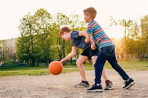 Two Happy Young Boys Playing Basketball Stock Image Colourbox