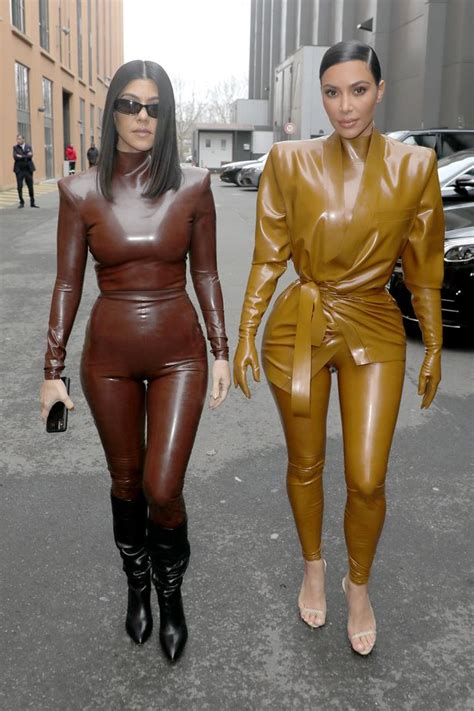 Kim Kardashian And Sister Kourtney Look Stunning In Skintight Latex Suits As They Hit Paris