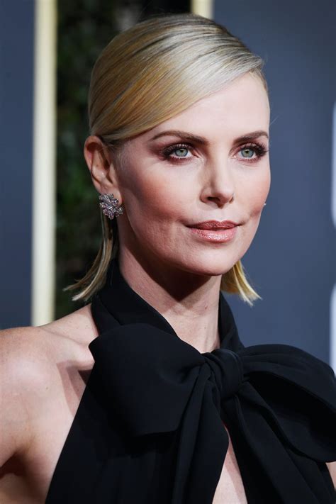 charlize theron went brunette for the oscars and fans can t get enough of her exquisite new look
