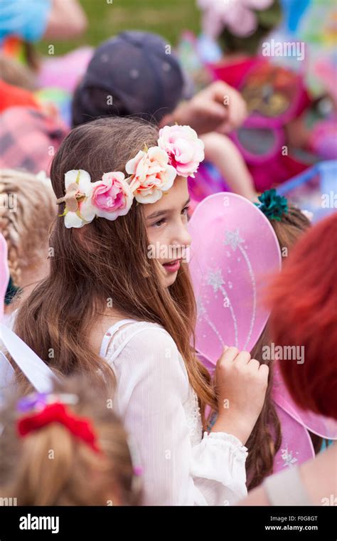 Young Girl Dressed As Fairy Amongst Crowd At The New Forest Fairy