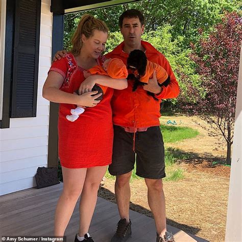 Amy Schumer Steals Hearts With Sweet Photo Cradling Her Adorable Seven Week Old Son Gene Daily