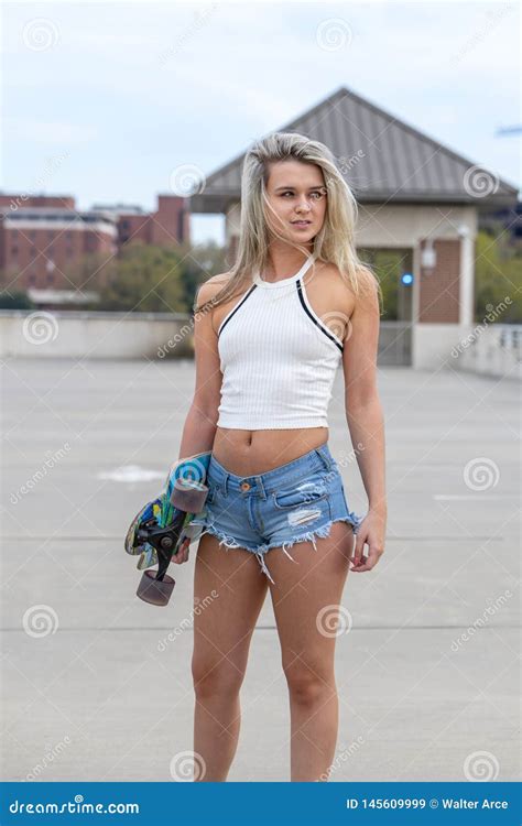 Gorgeous Young Coed Model Enjoying The Warm Weather With Her Skateboard Stock Image Image Of