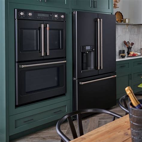 Cafe matte collection butter bell crocks. Green kitchen cabinets with GE Cafe Matte Collection in ...