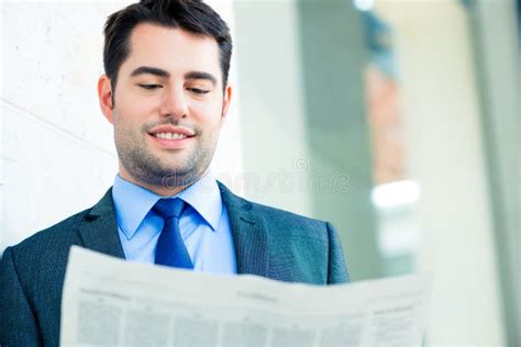 Businessman Reading Business Newspaper Stock Image Image Of Outdoor
