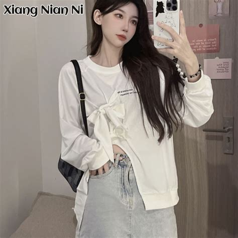 Xiang Nian Ni เสื้อยืดแขนยาวผู้หญิงเสื้อยืดสไตล์เกาหลีดีไซน์แหวกแนว