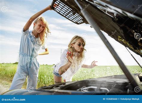 Young Lesbian`s Couple Going To Vacation Trip On The Car In Sunny Day