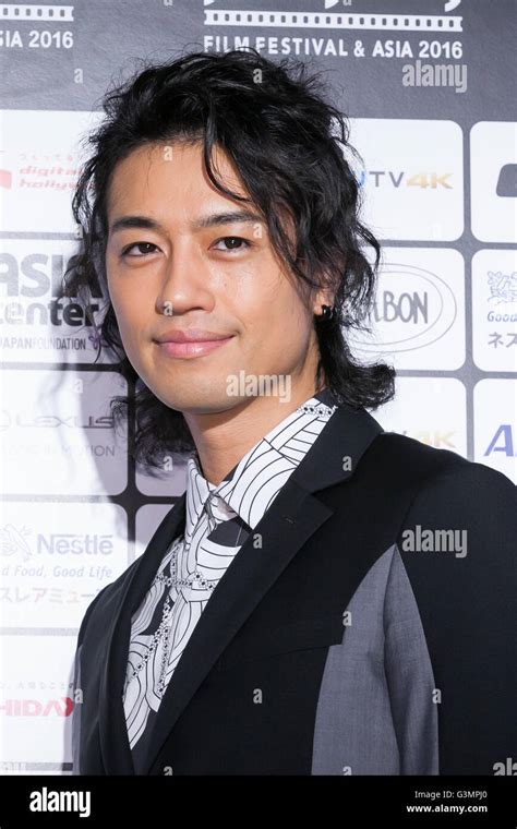 Actor Takumi Saito Poses For The Cameras On The Red Carpet During The