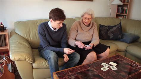 Grandson And Grandmother Playing Cards Stock Footage
