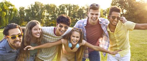 Multiracial Group Of Happy Cheerful Funny Friends Having Fun Outdoors In The Summer Stock