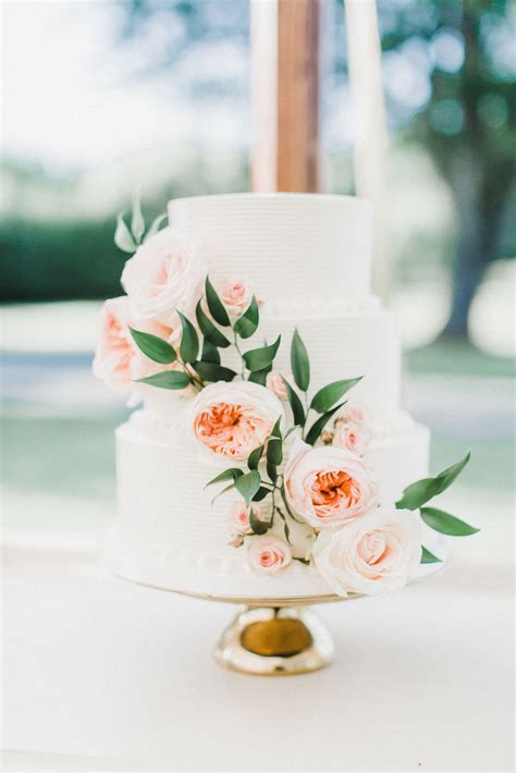 White Buttercream Wedding Cake With Cascading Fresh Flowers Wedding
