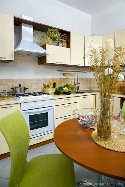 Throughout the 1980s and '90s, oak was a popular choice for kitchen cabinetry in homes across america, and this cabinet material remains in many homes today. #Kitchen of the Day: Modern yellow kitchens. | Kitchen cabinets, Kitchen design, Two tone ...