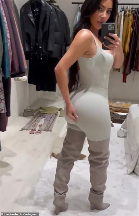 kim kardashian looks ready for summer as she shows off her sculpted midriff in a bikini daily