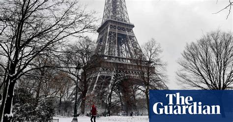Paris In The Snow In Pictures World News The Guardian