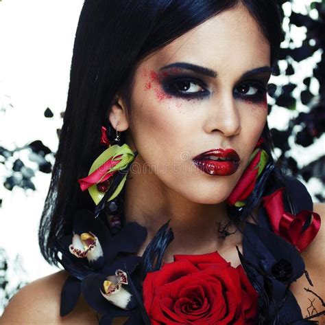 Pretty Brunette Woman With Rose Jewelry Black And Red Bright Make Up A Vampire Closeup Red