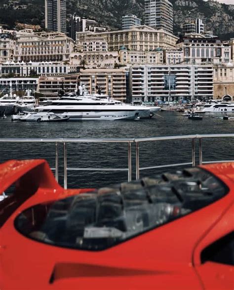 ferrari f40 on the deck of monaco yacht is drawing attention