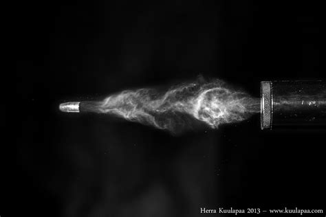 Awesome Photo Of A Bullet Cutting A Card And Other High Speed Images