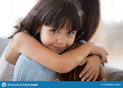 Adorable Little Daughter Hugging Mother Holding Tight Looking At Stock Image Image Of Mother