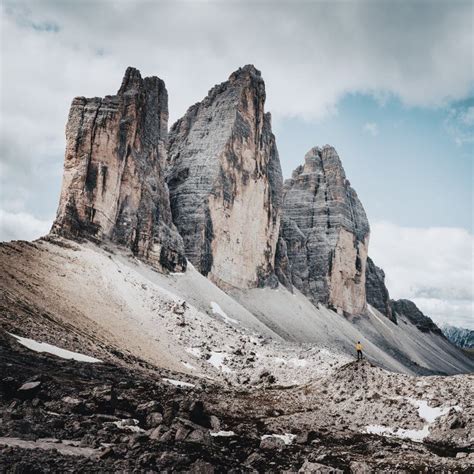Hiker And North Faces Of The Three Peaks Of Lavaredodolomitessouth