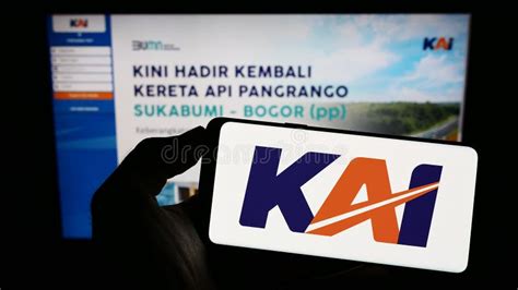 Person Holding Mobile Phone With Logo Of Indonesian Company Pt Kereta