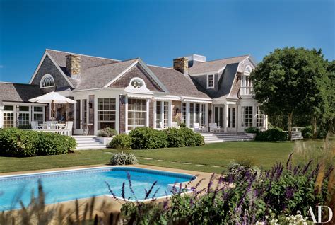 A Large House With A Pool In The Front Yard