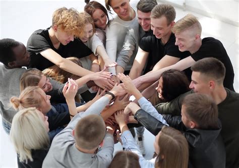 Premium Photo Group Of Diverse People Joining Their Hands In A Circle