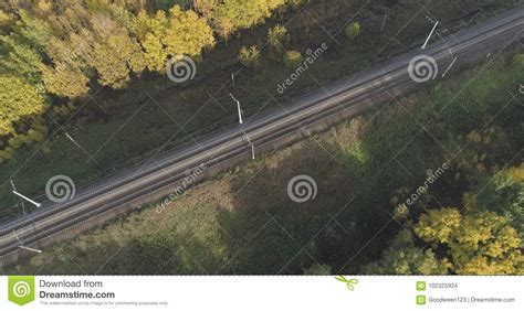 Aerial Shot Of Railroad Between Autumn Trees In Forest In October Stock