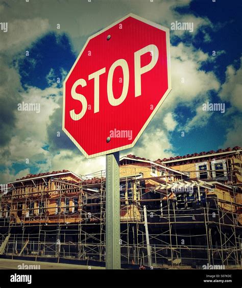 Ironic Stop Sign In Front Of New Construction Stock Photo Alamy