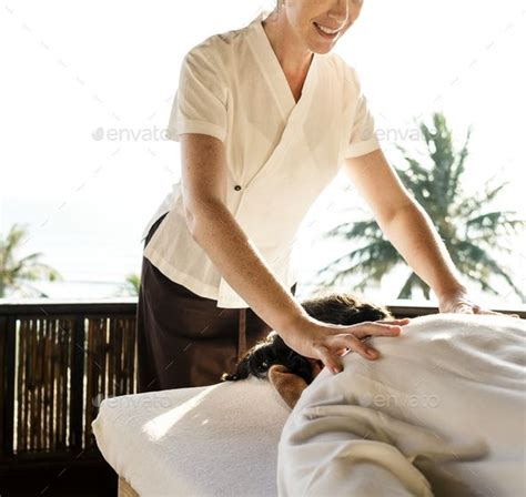 Female Massage Therapist Giving A Massage At A Spa By Rawpixel Female