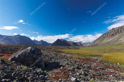 Colorful Rocky Tundra In Front Of River Valley Between Mountain — Stock