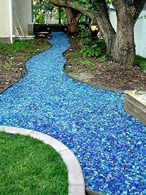 Here are 17 great tips for landscaping your backyard. diy garden path with concrete forms tumbled glass walkway ...