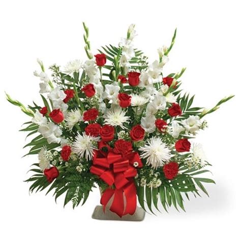 Many flowers were sent to the funeral home for my dad. Red & White Sympathy Floor Basket at Send Flowers