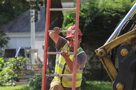 Construction Workers Climbing Down Ladder Stock Image F0124223