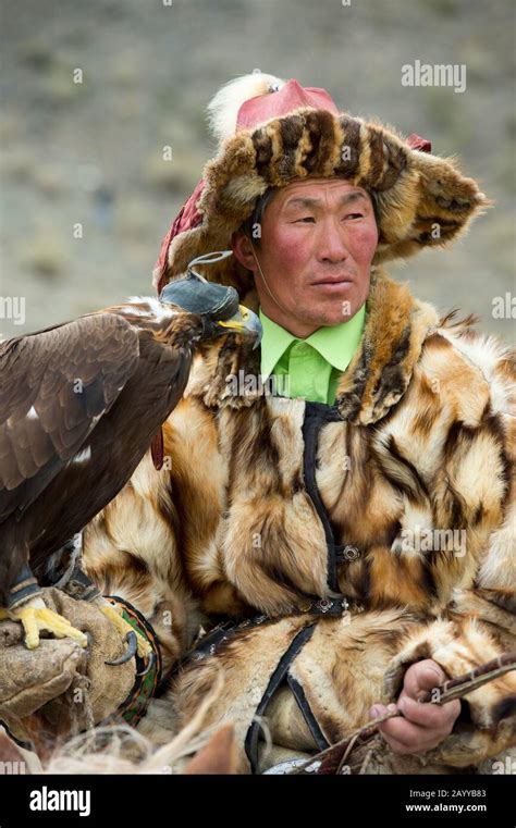 Portrait Of Kazakh Eagle Hunter At The Golden Eagle Festival On The