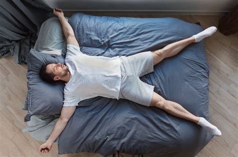 Man Sleeping Lying On Back In Bed At Home Top View Stock Photo Image