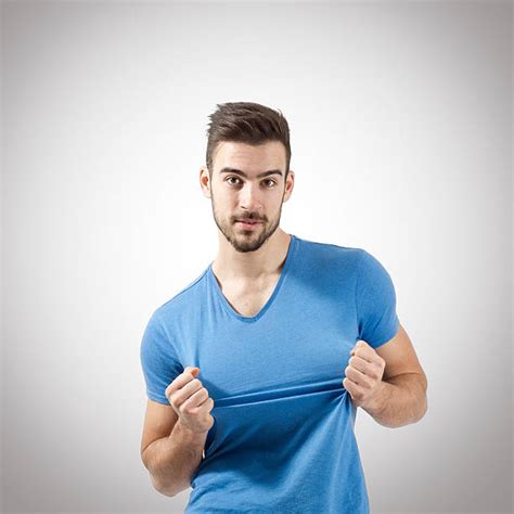 Best Pulling Shirt Stock Photos Pictures And Royalty Free Images Istock