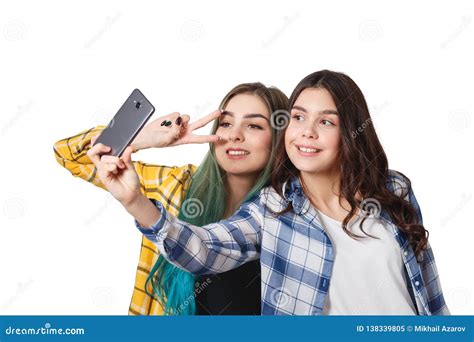 Two Girls Friends Taking Selfie With Smartphone Isolated On White