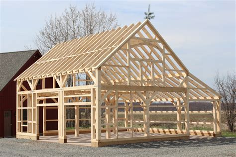 Pole barns feature poles that stick several feet into the ground. Building Process: Post and Beam Barns: The Barn Yard ...