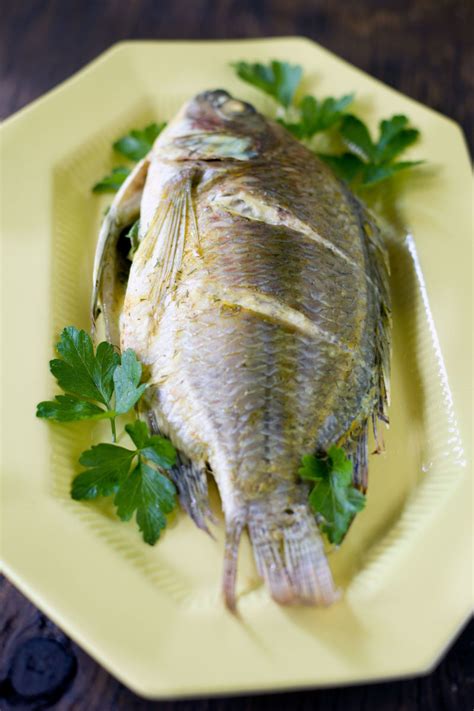 Put the baking dish in the preheated oven and cook the tilapia until it's completely cooked throughout. Baked Tilapia Recipe and How to Cook a Whole Fish - Eating ...