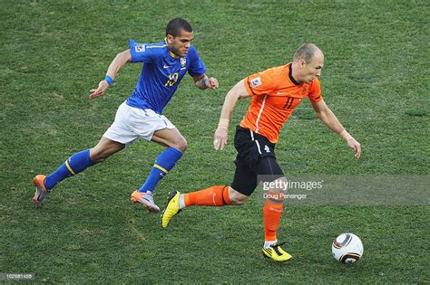 Arjen Robben Of The Netherlands Is Closed Down By Dani Alves Of News