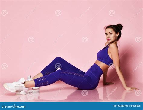 Sporty Slim Brunette Fitness Woman In Blue Sport Wear Doing Stretching