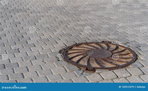 Rusty Sewerage Hatch In The Middle Of Pavers Stock Image Image Of