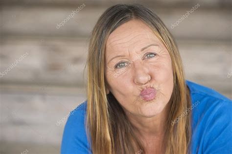 Portrait Happy Woman Pursed Lips Stock Photo By ©roboriginal 71585395