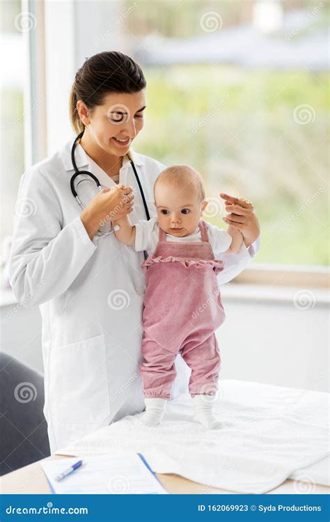 Female Pediatrician Doctor With Baby At Clinic Stock Image Image Of