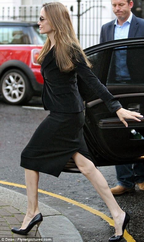 pale and pin thin angelina jolie reveals her sinewy legs in a pencil skirt daily mail online