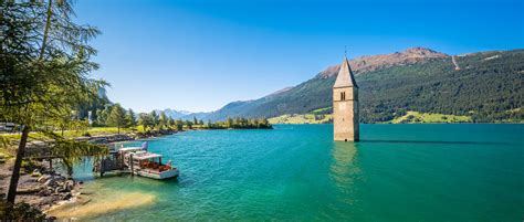 Lake Resia Ortler Mountains And Church Tower Alto Adige Italy Stock